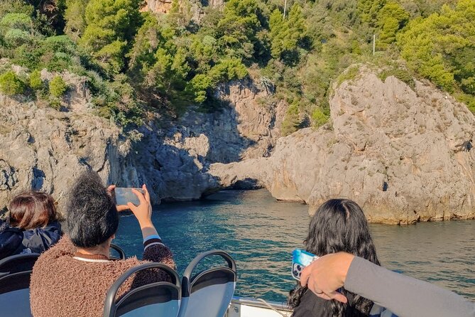 From Amalfi: Coast & Furore Fjord Boat Tour with Swim Break - Praiano + Capri in the distance: Faraglioni and Isola dei Galli