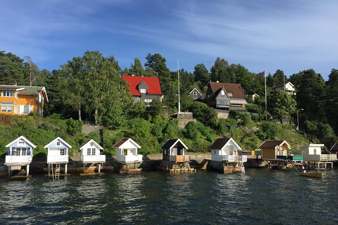 Oslo Combo Tour: Grand City Tour and Oslo Fjord Cruise - Riding out from Oslo City Hall in a comfortable coach